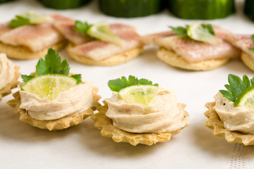 Small toast filled with tuna salad 