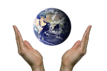 Two hands praying for our blue earth