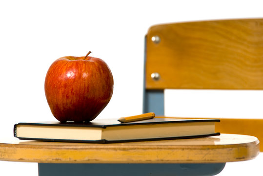 Close View Of School Desk With Aple