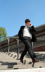 Businessman walking down the stairs 