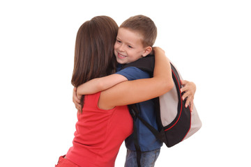 five years old boy and his mother with backpack isolated 