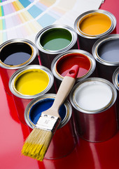 colorful cans and brush