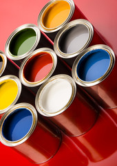 colorful cans on the red background