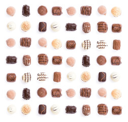 Chocolates in a uniform pattern isolated on white