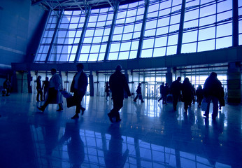 People silhouettes at airport building