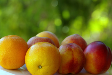 Naklejka na ściany i meble Peachs and orange fruits.
