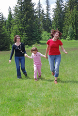 Obraz premium happy girls running in nature