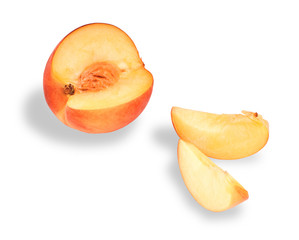 Peach cut on slices on a white background