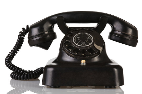 a old german telephone on white background