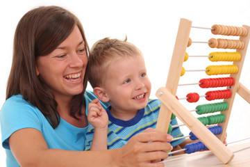 mother and 3-4 years old boy with big abacus isolated on white