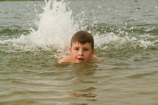 boy swims