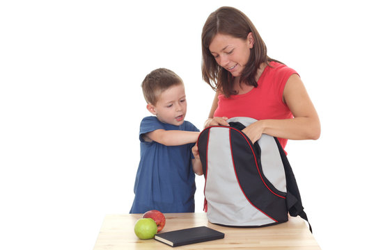 five years old boy and his mother with backpack isolated 