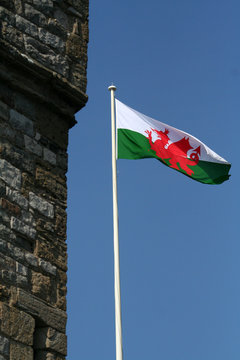 Welsh Flag Flying Next To A Castle