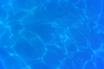 Abstract light lines on the floor of the swimming pool