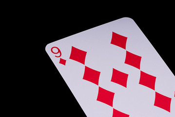 Fototapeta na wymiar A poker card slanted view over black background