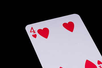 A poker card slanted view over black background