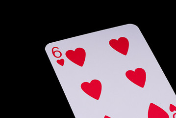 A poker card slanted view over black background