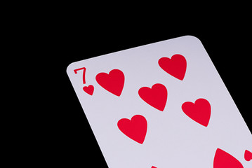 A poker card slanted view over black background