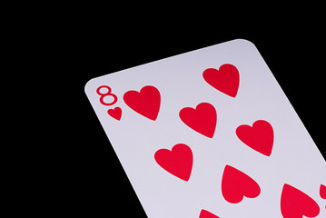 A poker card slanted view over black background