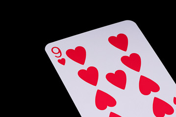 A poker card slanted view over black background