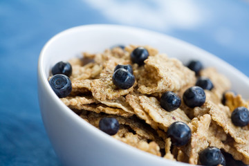Healthy breakfast cereal with fresh blueberries