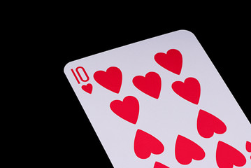 A poker card slanted view over black background