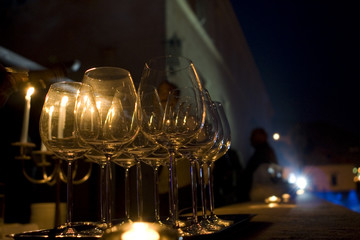 A set of wineglasses at a luxurious party in the night