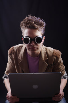 Portrait of a teens(hacker, student). Shot in studio..