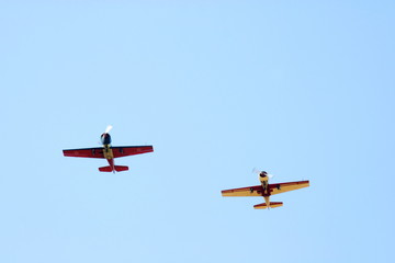 Two propeller-driven airplanes