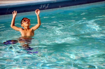 Boy With Orange Swm Goggles and Blue Swim Fins