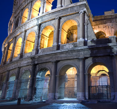 Colosseum Rome Italy With Night Lights At Dusk