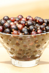 Blackcurrants in a clear glass bowl