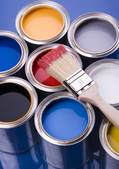 cans and brush on the blue background