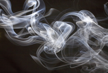 White smoke billowing on a black background