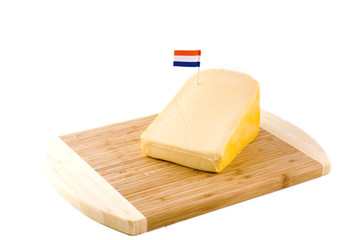 a big piece of Dutch cheese with a flag on it