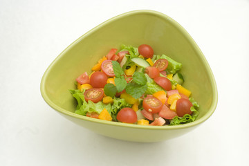Fresh newly made salad in green bowl