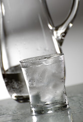 glass of fresh water with ice close up