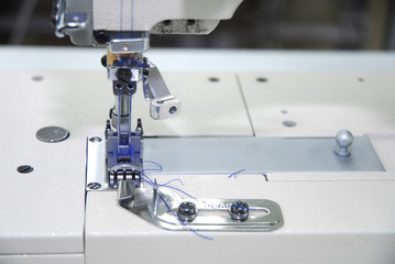 professional sewing-machine with blue thread