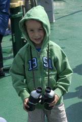 a young boy with binoculars