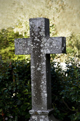 An old weathered cross at a cemetary