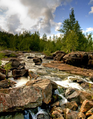 Summer scenery of remote rapids in Northern Sweden