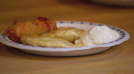 cabbage rolls,perogies, and sour cream