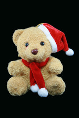 santa teddy bear on a black background