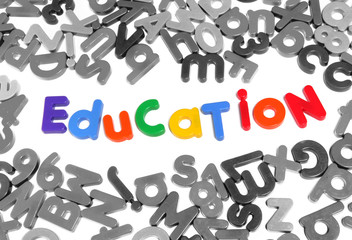 Colorful letters spelling out education over white