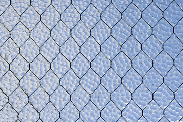 Fototapeta premium Wire-reinforced glass window. Abstract background