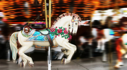Image of a horse on a carousel in motion © Vivid Pixels