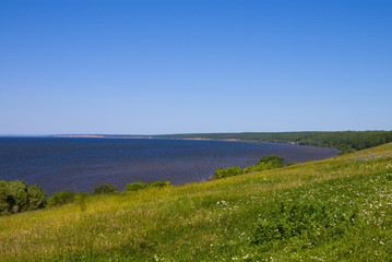 Fototapeta na wymiar Sunny coast of a bay of the river Volga