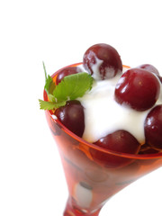 dessert in glass isolated on white(cherry with cream)
