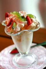 beautiful ice-cream in glass with fruits and chocolate