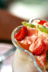 beautiful ice-cream in glass with fruits and chocolate